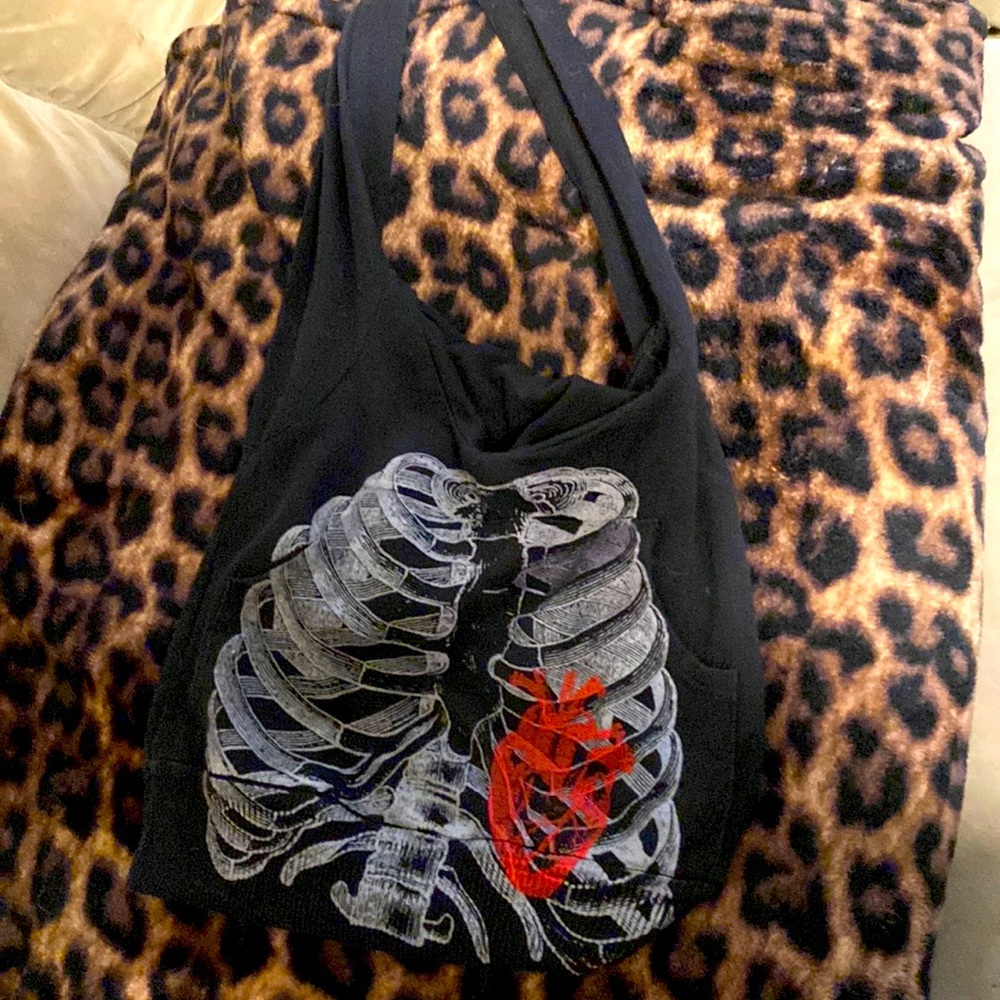 Rib hoodie purse bag with hood and pocket in front.